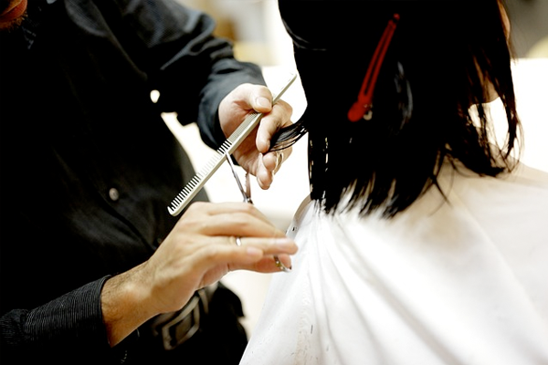 women getting hair cut in salon
